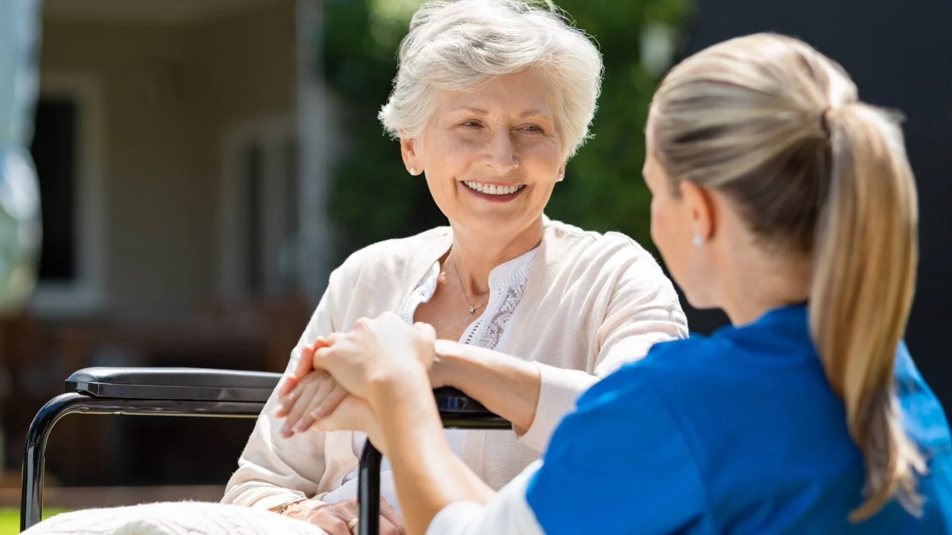 elderly woman and their caregiver participating in an Alzheimer's disease research study