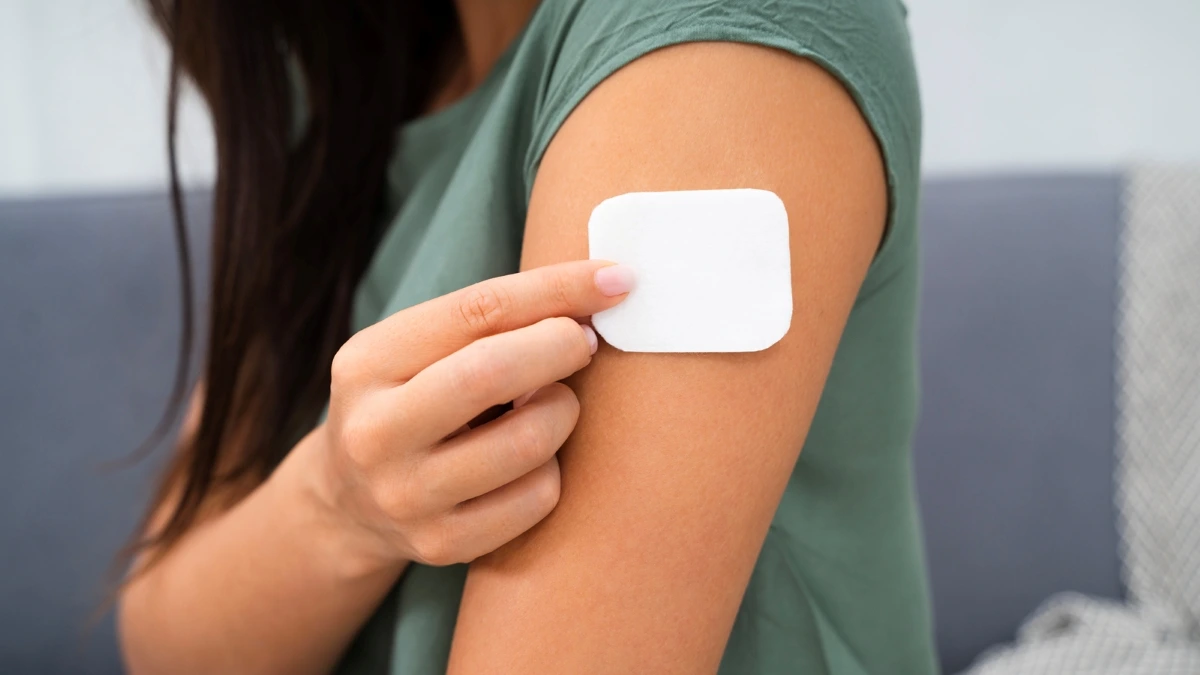 woman wearing a patch for a birth control research study