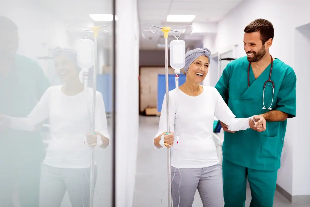 doctor assisting patient participating in cancer clinical trials