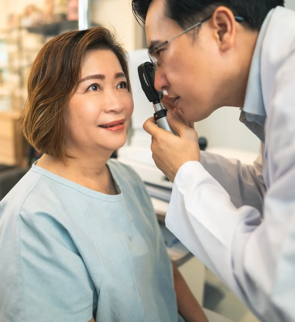 doctor examining a participant for eye conditions clinical trials