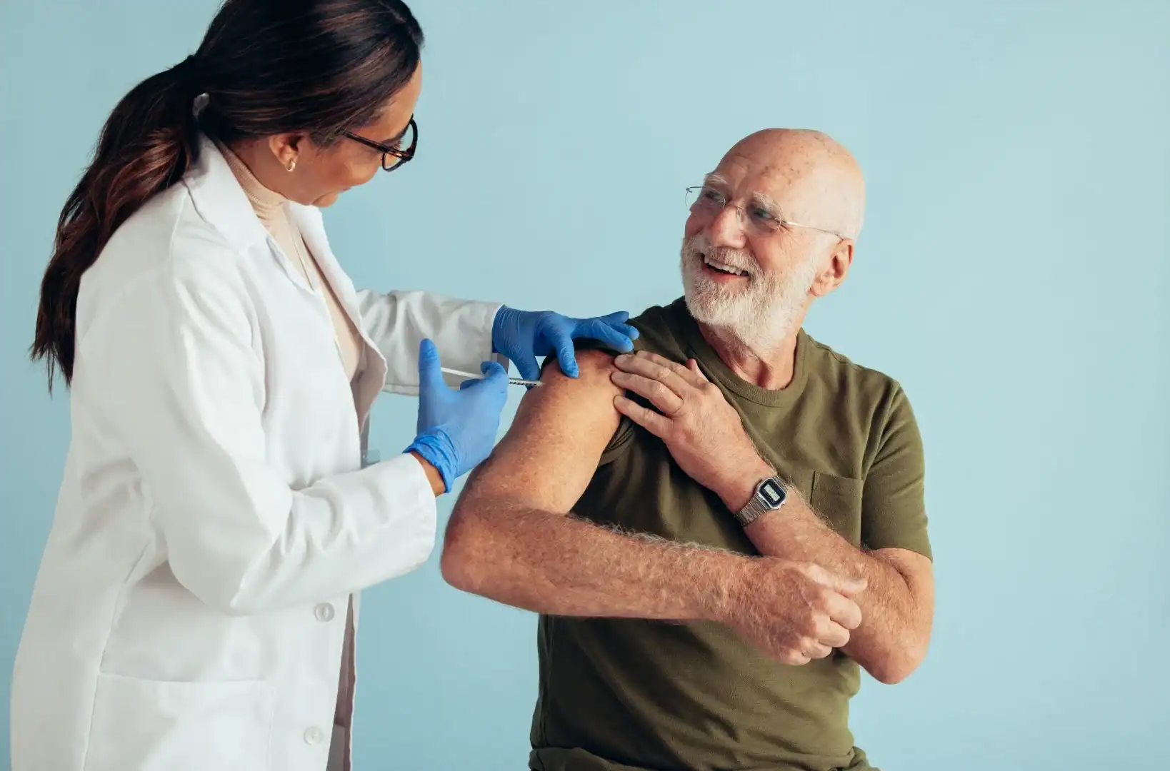 Elderly man getting injections for a flu vaccine clinical trial