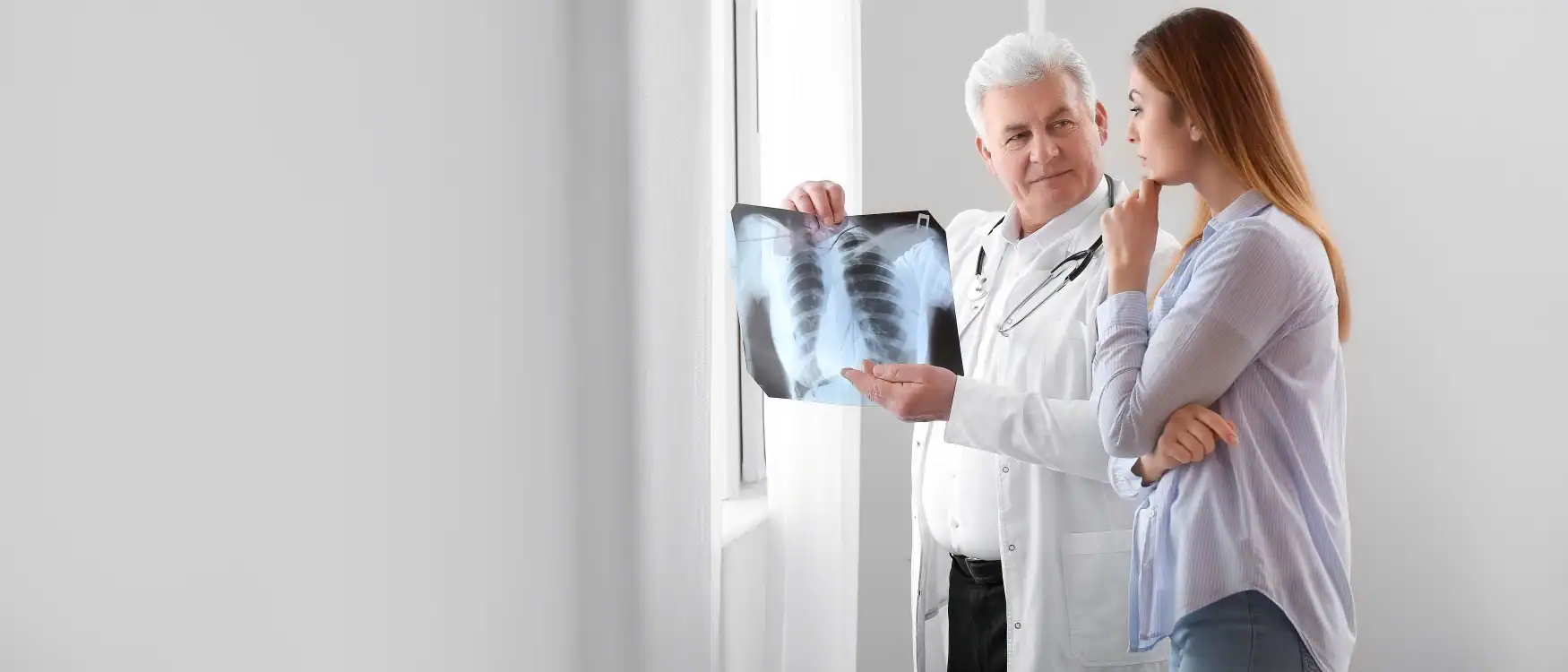 doctor showing xray for an infectious disease clinical trials participant