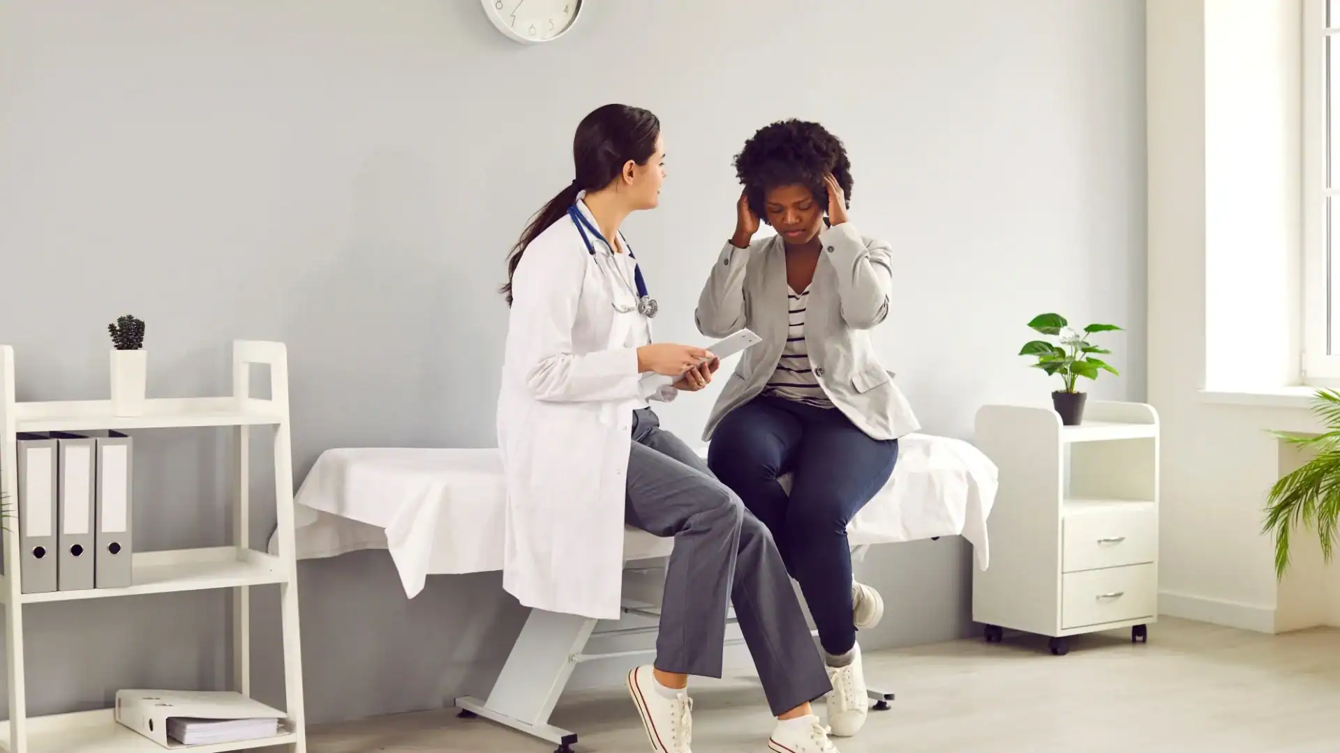 Doctor discussing a migraine research study with a patient