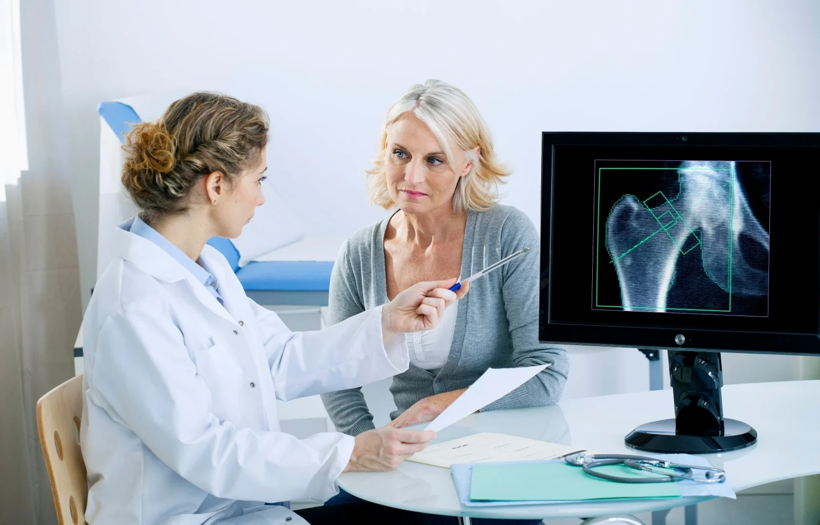 doctor evaluating a patient for an osteoporosis clinical trial