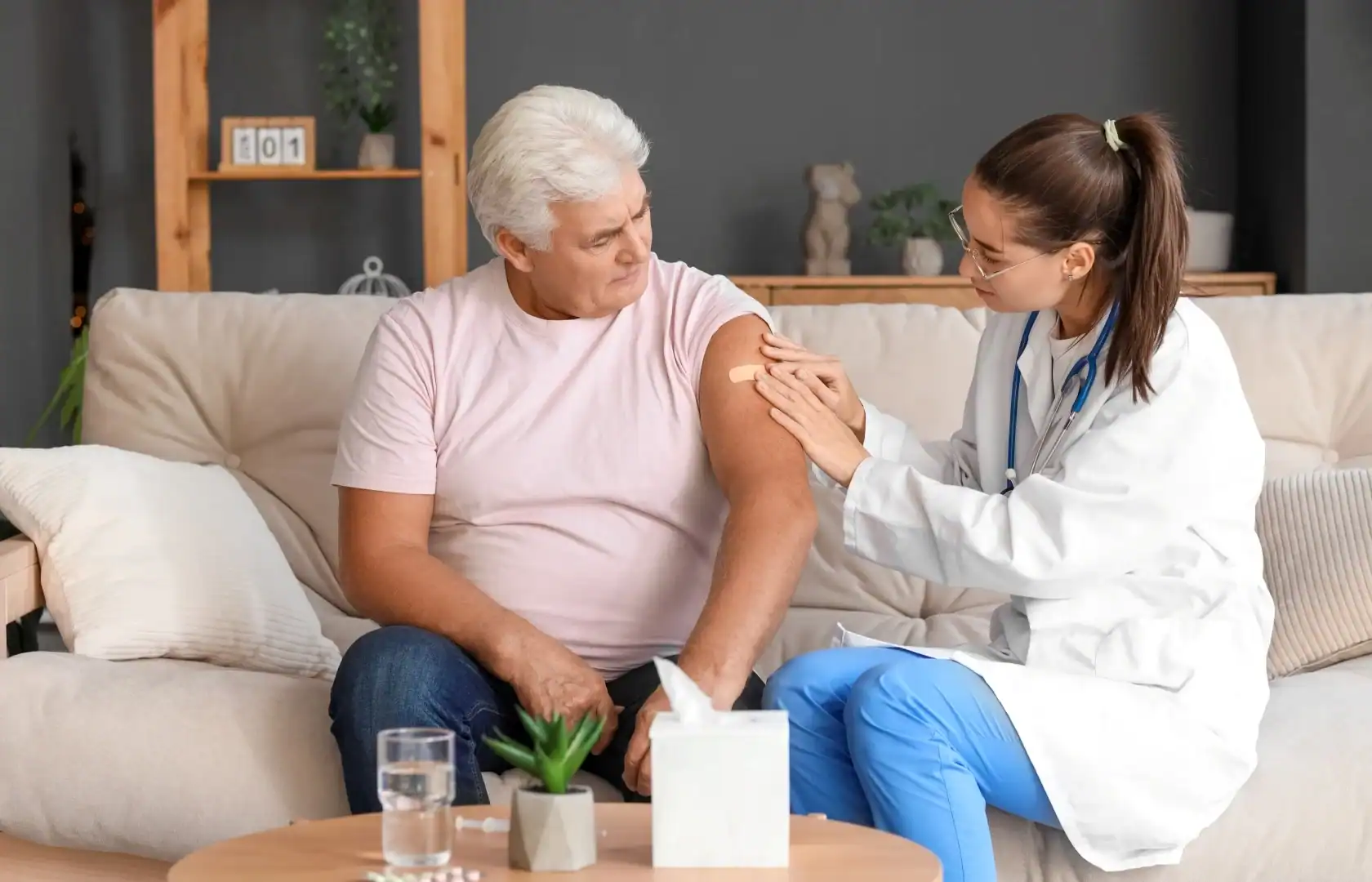 A senior man receives a vaccination as part of a flu vaccine clinical study.